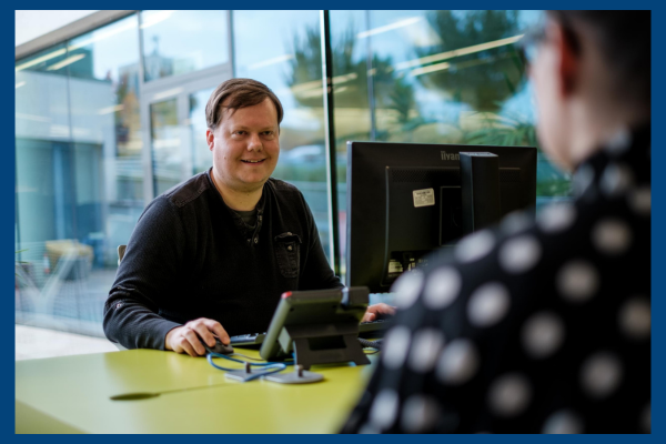 Man sitting at computer desk