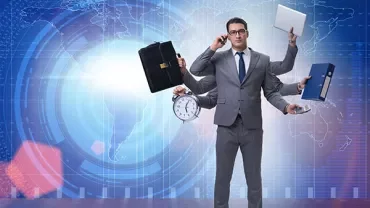 Person in suit juggling multiple tasks with clock, briefcase, and laptop.